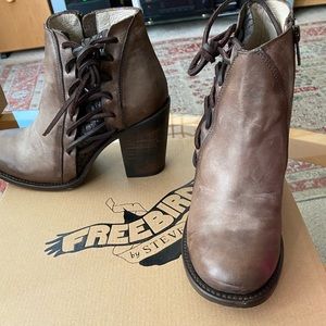 Cute booties with laces on the side. Worn twice. distressed leather